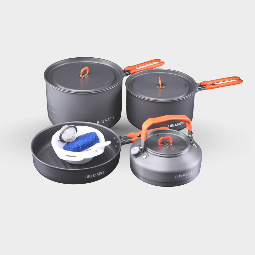 Set of camping cookware with gray pots and pans and orange handles on a white background #color_orange