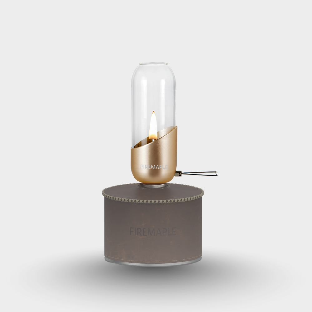 Portable camping stove with a gold burner and gray base on a light gray background #color_orange